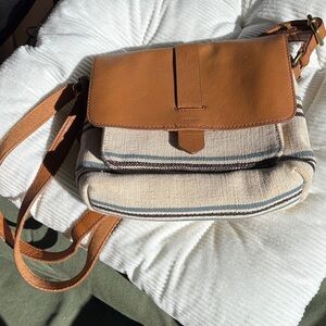 Fossil Which Features A Combination of Brown leather and Stripped Canvas Bag.